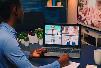 Remote black employee having video conference working from home